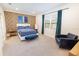 Stylish bedroom featuring wood accent wall, a plush bed, and bright natural light at 4012 Meandering Bay Dr, Apopka, FL 32712