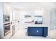 Bright kitchen with white cabinets, island, and stainless steel appliances at 4012 Meandering Bay Dr, Apopka, FL 32712