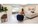 Living room features a comfy sitting area and sliding glass doors at 4012 Meandering Bay Dr, Apopka, FL 32712