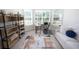 Bright living room showcasing a comfortable couch, modern shelving, and large windows at 4012 Meandering Bay Dr, Apopka, FL 32712