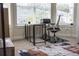 Office space features a stylish desk, rolling chair, and large bright windows at 4012 Meandering Bay Dr, Apopka, FL 32712