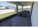 Screened patio with brick flooring and outdoor seating area at 4012 Meandering Bay Dr, Apopka, FL 32712
