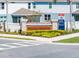 Community entrance sign 'Winding Meadows' with lush landscaping and 'Now Selling' notice at 4012 Meandering Bay Dr, Apopka, FL 32712