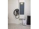 Indoor utility box for electric car charger and electrical panel on painted white block wall at 4012 Meandering Bay Dr, Apopka, FL 32712
