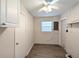 Functional basement features wood-look flooring, fresh paint, utility sink, and access doors at 479 Little Aspen Ct, Ocoee, FL 34761