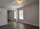 Bedroom with laminate flooring, closet, and natural light at 479 Little Aspen Ct, Ocoee, FL 34761