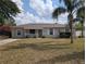 Charming single-story home with well-maintained front yard and mature trees at 479 Little Aspen Ct, Ocoee, FL 34761
