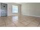 Spacious living room with tile floors, a window offering natural light, and neutral wall paint at 479 Little Aspen Ct, Ocoee, FL 34761