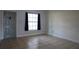 Living room with tile flooring, large window, and neutral paint at 479 Little Aspen Ct, Ocoee, FL 34761