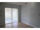 Living room with tile flooring and sliding doors to the screened porch at 479 Little Aspen Ct, Ocoee, FL 34761