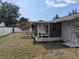 Home exterior view highlighting the screened porch extending to the backyard, perfect for outdoor living at 479 Little Aspen Ct, Ocoee, FL 34761