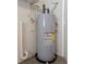 Efficient water heater is in utility area, ready to supply ample hot water throughout the residence at 479 Little Aspen Ct, Ocoee, FL 34761