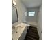 Well-lit bathroom featuring a vanity with modern fixtures and a shower-tub combo at 545 Brooks Ct, Polk City, FL 33868