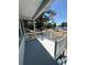 Charming front porch offering a picturesque view of the lake in a tranquil setting at 545 Brooks Ct, Polk City, FL 33868