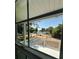 Scenic view of a lake and deck through a window, enhancing the property's appeal at 545 Brooks Ct, Polk City, FL 33868