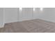 Finished basement with neutral carpet and lighting fixtures at 10013 Brocksport Cir, Gotha, FL 34734