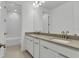 Bathroom featuring double sinks with modern fixtures and tile flooring at 10013 Brocksport Cir, Gotha, FL 34734