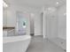 Modern bathroom featuring a soaking tub and glass enclosed shower at 10013 Brocksport Cir, Gotha, FL 34734