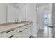 Well-lit bathroom with a light countertop, modern fixtures, and sleek tile floors at 10013 Brocksport Cir, Gotha, FL 34734