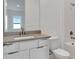 Bathroom featuring single sink with modern fixtures and vanity at 10013 Brocksport Cir, Gotha, FL 34734