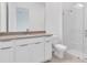 Bright bathroom featuring a glass shower and vanity with white cabinets at 10013 Brocksport Cir, Gotha, FL 34734
