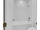 Bathroom featuring a white tiled shower and tub combination at 10013 Brocksport Cir, Gotha, FL 34734