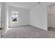 Bright bedroom with carpeted floor, a window, and view to a walk-in closet at 10013 Brocksport Cir, Gotha, FL 34734