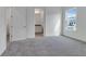 Bedroom featuring neutral carpet and view to an en-suite bathroom at 10013 Brocksport Cir, Gotha, FL 34734