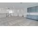 Open bonus room with a wet bar, neutral carpet, and access to other living spaces at 10013 Brocksport Cir, Gotha, FL 34734