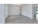 Spacious dining room with modern chandelier and abundant natural light perfect for gatherings at 10013 Brocksport Cir, Gotha, FL 34734
