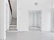 Inviting foyer with staircase and an open doorway to a bright, airy room at 10013 Brocksport Cir, Gotha, FL 34734