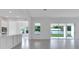 Open-concept living room with tiled flooring and natural light at 10013 Brocksport Cir, Gotha, FL 34734