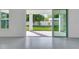 Spacious living room with sliding glass doors to the outdoor living space at 10013 Brocksport Cir, Gotha, FL 34734