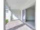 Covered patio with white columns, brick flooring and a sliding door providing easy access to the indoors at 10013 Brocksport Cir, Gotha, FL 34734