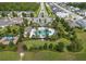 Aerial view of a community pool with playground, picnic area and palm trees at 1062 Lakeside Estates Dr, Apopka, FL 32703