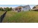 Expansive backyard features a screened-in porch and meticulously manicured lawn at 1062 Lakeside Estates Dr, Apopka, FL 32703