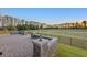 The brick paved patio offers a view of the expansive backyard and neighboring wooded area at 1062 Lakeside Estates Dr, Apopka, FL 32703