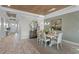 Elegant dining room showcasing a stylish chandelier and view to the front door at 1062 Lakeside Estates Dr, Apopka, FL 32703