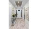 Inviting foyer with light wood floors, recessed lighting, and a view of the front door at 1062 Lakeside Estates Dr, Apopka, FL 32703