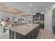 A open-concept kitchen leads into a living room with comfortable seating and elegant decor at 1062 Lakeside Estates Dr, Apopka, FL 32703