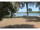Lakefront picnic area with picnic table, park bench, lake view and a shaded gazebo at 1062 Lakeside Estates Dr, Apopka, FL 32703