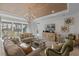 Bright living room featuring a cozy seating arrangement and view of the backyard at 1062 Lakeside Estates Dr, Apopka, FL 32703