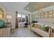 A bedroom featuring neutral tones, a workstation, and ample natural light at 1062 Lakeside Estates Dr, Apopka, FL 32703