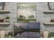 Close-up of office decor featuring floating shelves, artwork, and a modern television at 1062 Lakeside Estates Dr, Apopka, FL 32703