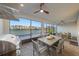 This outdoor dining area features a built-in outdoor kitchen and screened views at 1062 Lakeside Estates Dr, Apopka, FL 32703