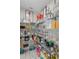 Walk-in pantry with ample shelving and storage, ideal for organization in this home at 1062 Lakeside Estates Dr, Apopka, FL 32703