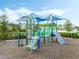 Fun community playground with colorful structures and a safe, cushioned surface at 1062 Lakeside Estates Dr, Apopka, FL 32703