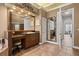 A beautifully appointed bathroom features a vanity with lots of counter space, and a large decorative mirror at 10664 Emerald Chase Dr, Orlando, FL 32836
