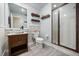 Modern bathroom featuring a vessel sink, framed mirror, and a glass-enclosed shower at 10664 Emerald Chase Dr, Orlando, FL 32836