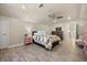 Spacious bedroom with a ceiling fan, and a large bed with a colorful quilt at 10664 Emerald Chase Dr, Orlando, FL 32836